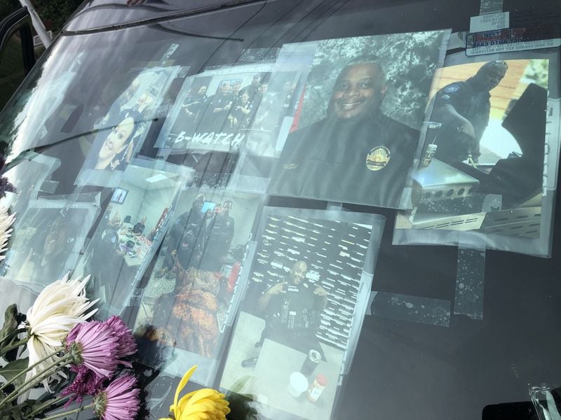 Martin was a beloved officer, colleagues say. Following his death, police placed his patrol car in front of the Alpharetta Department of Public Safety building and adorned it with photos and memories from fellow officers. Courtesy Alpharetta Department of Public Safety
