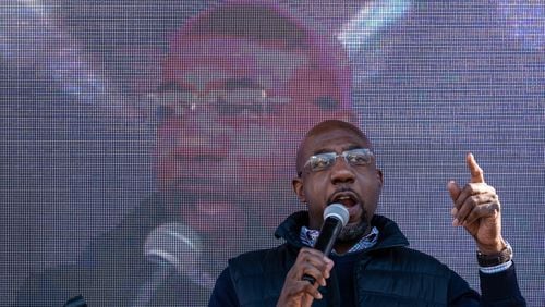 201229-Atlanta-The Rev. Raphael Warnock speaks during a Unite Here union meeting at the Starlight Drive In in Atlanta on Tuesday morning, Dec. 29, 2020. Ben Gray for the Atlanta Journal-Constitution