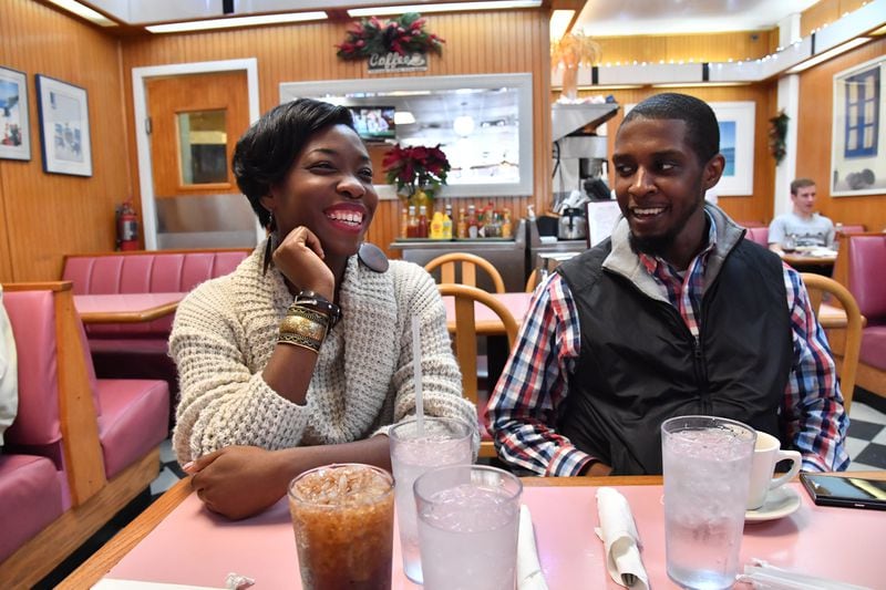 Janelle Jones smiles with her boyfriend Alexander Gothard as they meet for a lunch at White House Restaurant in Buckhead on Tuesday, December 20, 2016. HYOSUB SHIN / HSHIN@AJC.COM