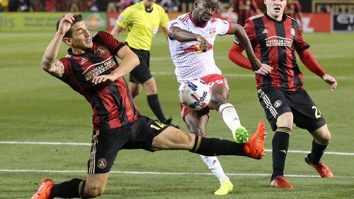March 5, 2017, Atlanta: Atlanta United FC Carlos Carmona can't block a shot by N.Y. Red Bulls Bradley Wright-Phillips during the second half in the first game in franchise history on Sunday, March 5, 2017, in Atlanta. Wright-Phillips scored the winning goal to defeat the Atlanta United RC 2-1.  Curtis Compton/ccompton@ajc.com