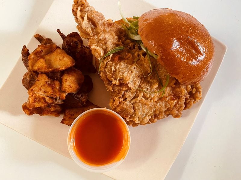 You can get Leftie Lee’s Korean fried chicken sandwich with crispy potatoes on the side. Bob Townsend for The Atlanta Journal-Constitution