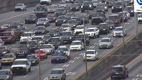 Delays are building on metro Atlanta's interstates Friday afternoon as drivers head out of town for Memorial Day weekend in this 2021 AJC file photo.