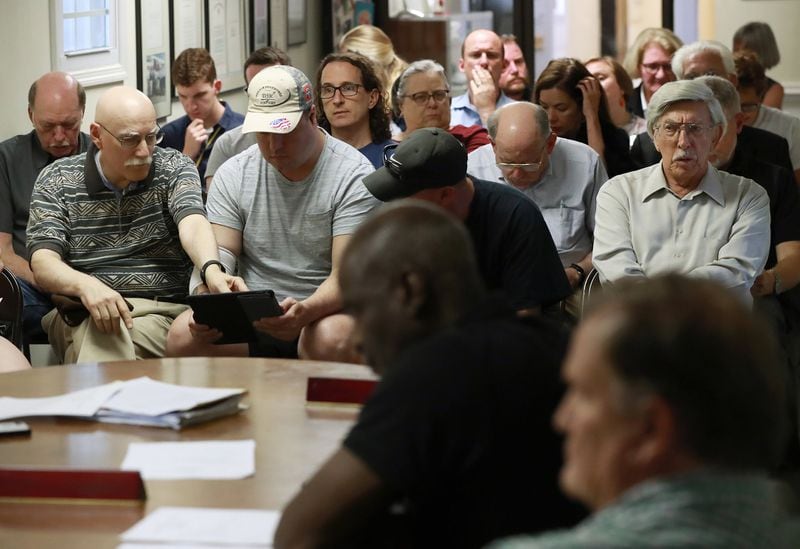 Local residents attend an airport advisory board meeting at DeKalb-Peachtree Airport to hear discussion on plans to build eight new hangers close to Clairmont Road. (Photo: Curtis Compton/ccompton@ajc.com)