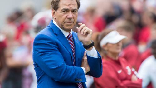 Alabama head coach Nick Saban, here watching his players warm up for a spring game, is blocking the potential transfer of a player to Georgia (Vasha Hunt/ AL.com)