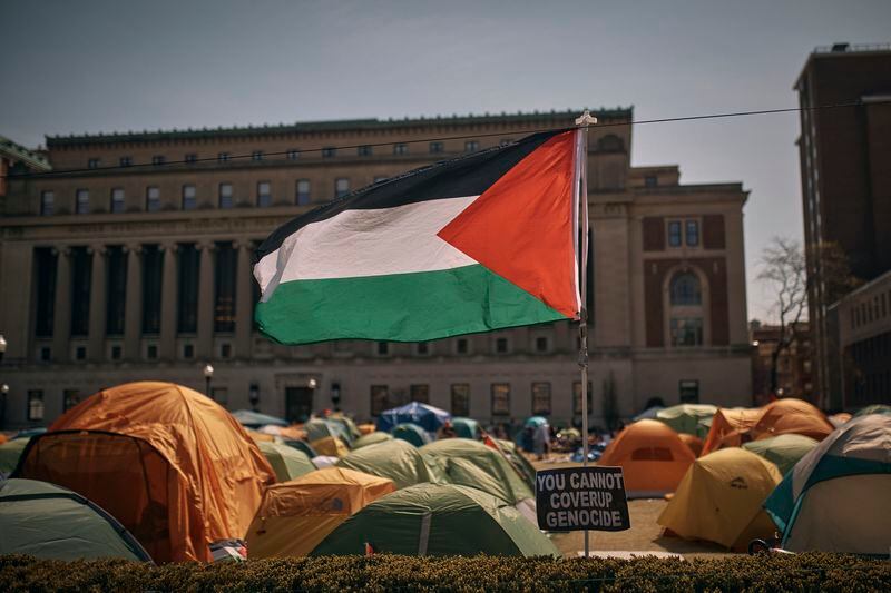 A Palestinian flag flutters in the wind during a pro-Palestinian encampment, advocating for financial disclosure and divestment from all companies tied to Israel and calling for a permanent ceasefire in Gaza, inside Columbia University Campus on Sunday, April 28, 2024, in New York. (AP Photo/Andres Kudacki)