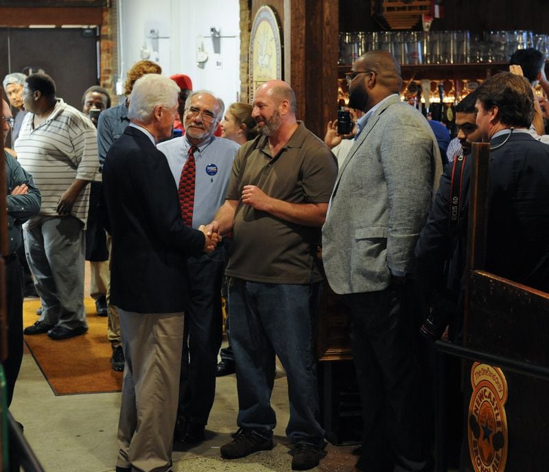 Former President Bill Clinton at Manuel’s Tavern for a quick visit and a handshake with owner Brian Maloof. (BECKY STEIN PHOTOGRAPHY)