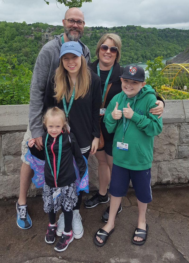 Cheryl and Jeremy Smith of Dallas, Ga., (rear) signed up to become foster parents after learning of the need caused by the growing opioid epidemic. Emily (pictured in the front) is one of four children to whom they’ve opened their home; they ended up adopting Emily. CONTRIBUTED