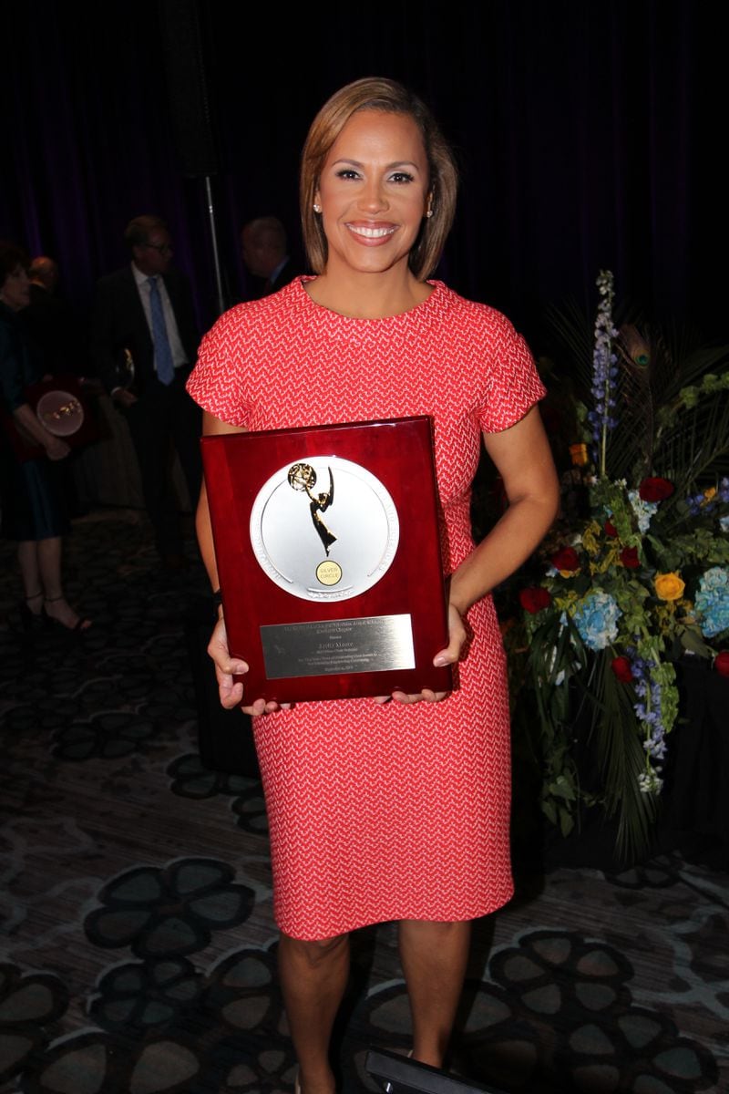  Jovita Moore shows off her NOTAS Silver Circle award after 27 years in broadcast television. CREDIT: NATAS