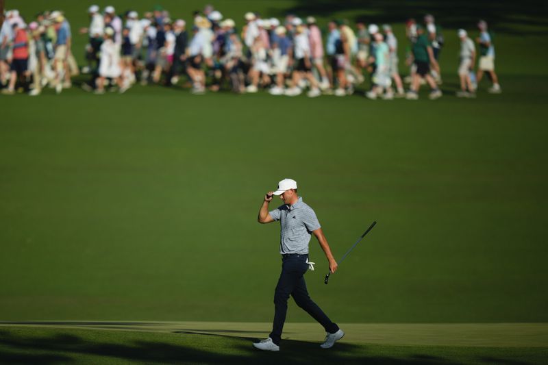 Ludvig Aberg, of Sweden, waves after making a putt on the 15th hole during final round at the Masters golf tournament at Augusta National Golf Club Sunday, April 14, 2024, in Augusta, Ga. (AP Photo/Matt Slocum)