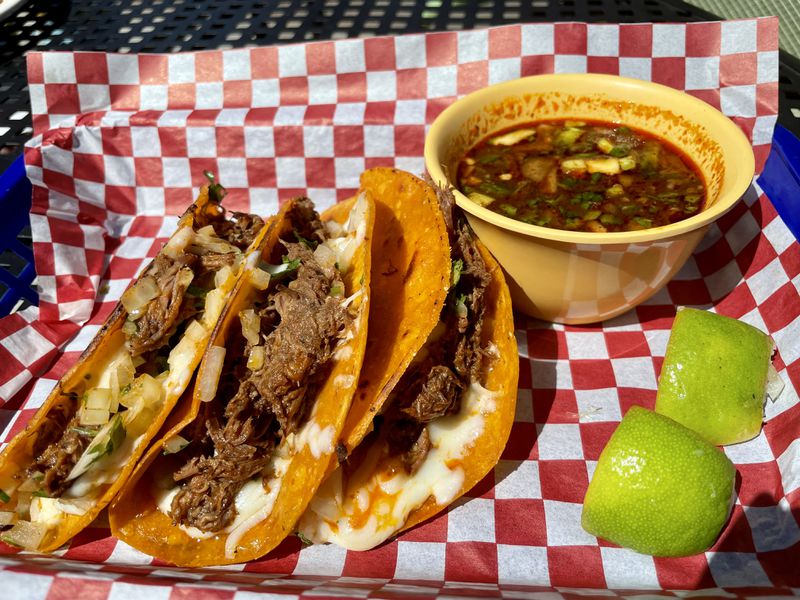 Birria tacos and consomme for dipping at Frida's Taqueria in Lilburn.
(Angela Hansberger for The Atlanta Journal-Constitution)