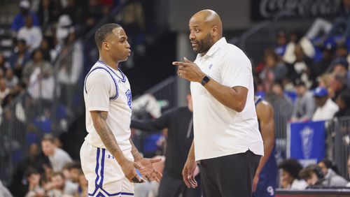 Georgia State Panthers head coach Jonas Hayes, right, talks with guard Dwon Odom (1) during their game against the Georgia Southern Eagles in a NCAA men’s basketball game at the Georgia State Convocation Center, Thursday, February 2, 2023, in Atlanta. Georgia State won 64-60. Jason Getz / Jason.Getz@ajc.com)