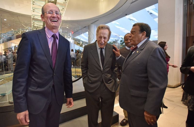 From 2016: Architect and developer John Portman (center) and Andrew Young talk as A.J. Robinson (left), President of Central Atlanta Progress, bursts into a laugh during an opening ceremony for Hotel Indigo in downtown Atlanta. The hotel is part of the redeveloped Peachtree Center office tower 230 Peachtree. HYOSUB SHIN / HSHIN@AJC.COM