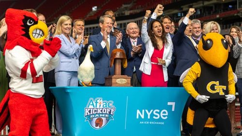Gov. Brian Kemp claps after remotely ringing the New York Stock Exchange opening bell from Mercedes-Benz Stadium  in Atlanta on Friday, September 1, 2023, ahead of the inaugural Aflac Kickoff Game. It’s the first time the NYSE opening bell has been rung from the state of Georgia. (Arvin Temkar / arvin.temkar@ajc.com)