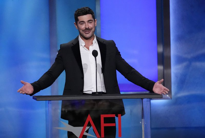 Actor Zac Efron speaks from the stage during the 49th AFI Life Achievement Award tribute to Nicole Kidman, Saturday, April 27, 2024, at the Dolby Theatre in Los Angeles. (AP Photo/Chris Pizzello)