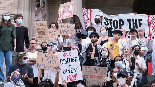 Pro-Palestinian protesters marched from the Arch entrance at the University of Georgia to City Hall in Athens on Friday, May 3, 2024. (Nell Carroll for The Atlanta Journal-Constitution)