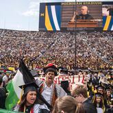 Rawan Antar, 21, center, chants in support of Palestinians during the University of Michigan's Spring 2024 Commencement Ceremony at Michigan Stadium in Ann Arbor, Mich., on Saturday, May 4, 2024. (Katy Kildee/Detroit News via AP)