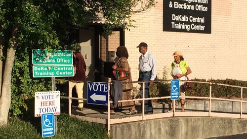 Voters walk in The DeKalb County Voter Registration and Elections Office off Memorial Drive on Monday morning as early voting begins. JOSHUA SHARPE/JOSHUA.SHARPE@AJC.COM