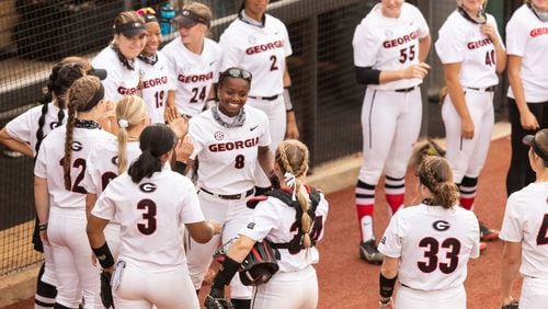 Georgia outfielder Jayda Kearney (8) gets high fives from her teammates before the Alabama game at the Jack Turner Softball Stadium in Athens on Friday, Apr. 30, 2021. (Photo by Mackenzie Miles/UGA Athletics)