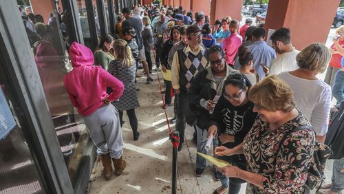 People lined up for early voting on Thursday Oct. 18, 2018 at the Cobb County West Park Government Center at 736 Whitlock Ave NW in Marietta JOHN SPINK/JSPINK@AJC.COM