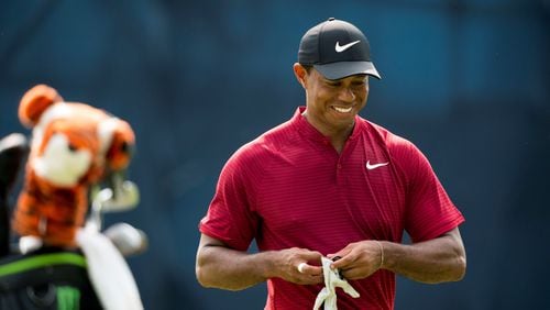 Tiger Woods reacts after sinking a putt n the 10th green and saving par in the final round of the PGA Championship  tournament at Bellerive Country Club in St. Louis, Aug. 12, 2018. Woods finished second after recording a six-under 64 in the final round. (Doug Mills/The New York Times)