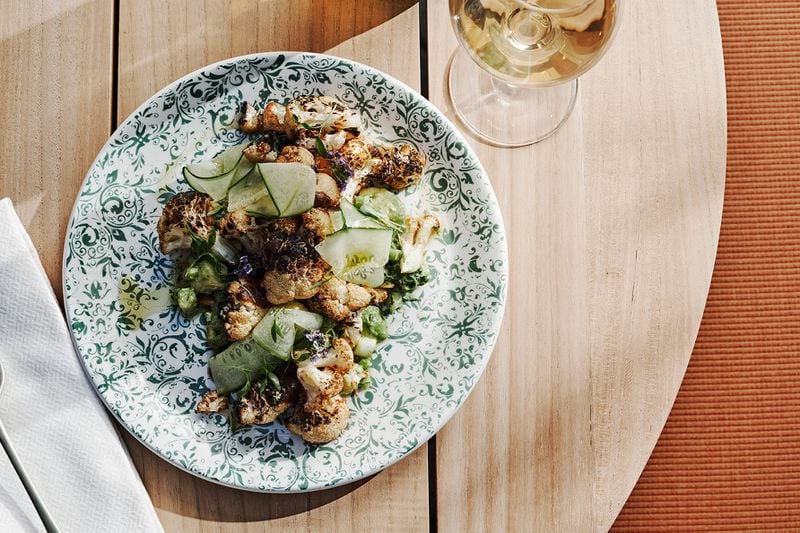 Charred cauliflower and cucumber is among the plant-forward, shareable plates on the menu at the Willow Bar at the Kimpton Sylvan Hotel in Buckhead. Courtesy of Andrew Thomas Lee
