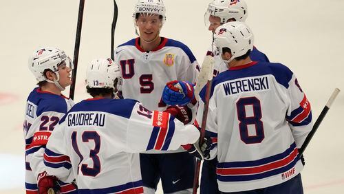 Unted States' Brady Tkachuk celebrates with teammates after scoring his side's fourth goal during the preliminary round match between United States and Kazakhstan at the Ice Hockey World Championships in Ostrava, Czech Republic, Sunday, May 19, 2024. (AP Photo/Darko Vojinovic)