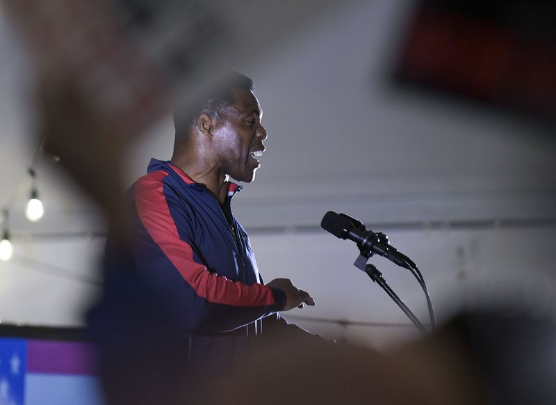 In the Nov. 8 midterms, Republican U.S. Senate hopeful Herschel Walker was unable to draw votes from roughly 200,000 voters who had backed GOP Gov. Brian Kemp in his reelection bid. (Daniel Varnado/For the AJC)