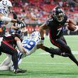 Atlanta Falcons running back Bijan Robinson (7) avoids a tackle from Indianapolis Colts defensive back JuJu Brents (29) during the fourth quarter at Mercedes-Benz Stadium on Sunday, Dec. 24, 2023, in Atlanta. (Kevin C. Cox/Getty Images/TNS)