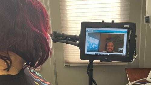 Dr. Antonio Campbell (onscreen) works with a patient in Macon to access vision needs. The Chamblee-based Lions Lighthouse Foundation provides services to parts of the state where they are unavailable.