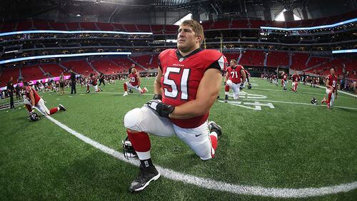 Falcons center Alex Mack (51) warms up before an exhibition game against the Jacksonville Jaguars, Thursday, Aug. 31, 2017, at Mercedes-Benz Stadium in Atlanta.