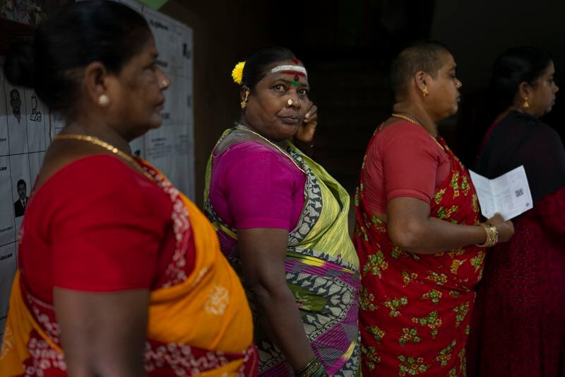 Women queue up to cast their votes during the first round of polling of India’s national election in Chennai, southern Tamil Nadu state, Friday, April 19, 2024. Nearly 970 million voters will elect 543 members for the lower house of Parliament for five years, during staggered elections that will run until June 1. (AP Photo/Altaf Qadri)