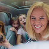 Atlanta-based photographer Kate Parker, pictured with her kids and dog, has a new book filled with girls (and women) finding and using their voices. Image credit: Workman Press.