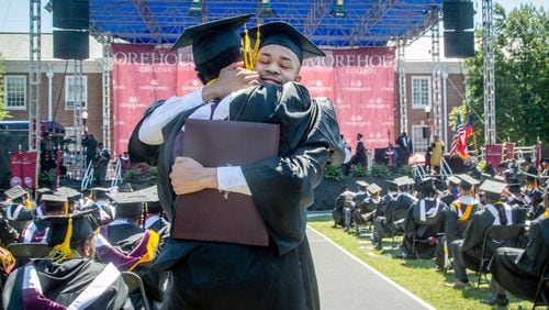 Graduates react after receiving their diploma during the 137th commencement that celebrates the classes of 2020 and 2021 on the Century Campus at Morehouse College on Sunday, May 16, 2021. (Photo: Steve Schaefer for The Atlanta Journal-Constitution)