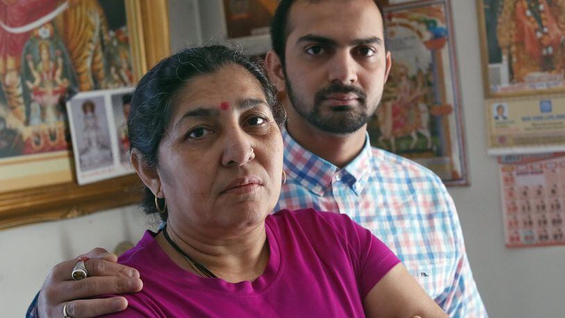 Ramilaben Patel (left), photographed with her son, Rohit Patel, won a $5 million scratch-off prize but has been denied payment after Georgia Lottery officials accused her of attempting to claim the prize for someone else. The dispute is now the subject of a lawsuit in Fulton County Superior Court and tests the Lottery’s ability to deny prizes without specific proof of fraud. BOB ANDRES /BANDRES@AJC.COM