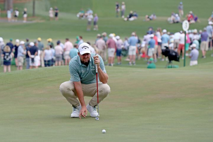 April 9, 2021, Augusta: Marc Leishman looks over his birdie attempt on the seventh hole during the second round of the Masters at Augusta National Golf Club on Friday, April 9, 2021, in Augusta. Curtis Compton/ccompton@ajc.com