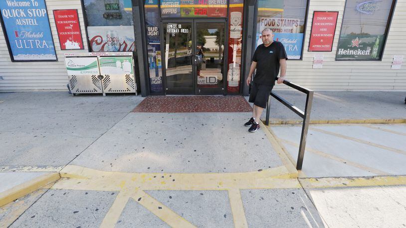 Tony Farha is the owner of a convenience store in Marietta. He had to install hand holds in the restroom and a ramp at the front of the store. He was served with an ADA lawsuit in 2017 which cost him about $15,000 to settle. The federal courts in Georgia have seen a dramatic rise in the number of lawsuits from plaintiffs claiming restaurants, convenience stores, hotels and other businesses discriminated against them by failing to accommodate their disability. BOB ANDRES / ROBERT.ANDRES@AJC.COM