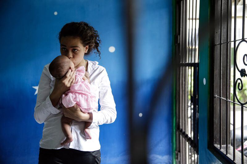 Heather Mack, then 19, holds her baby daughter in a cell as she awaited her verdict hearing on April 21, 2015 in Denpasar, Bali, Indonesia. She was sentenced by an Indonesian judge to 10 years and her boyfriend Tommy Schaefer was sentenced to 18 years in prison after they were found guilty of murdering Mack's mother, Sheila von Wiese-Mack, whose body was found stuffed inside a suitcase in the back of a taxi outside a luxury Bali hotel in August 2014. 