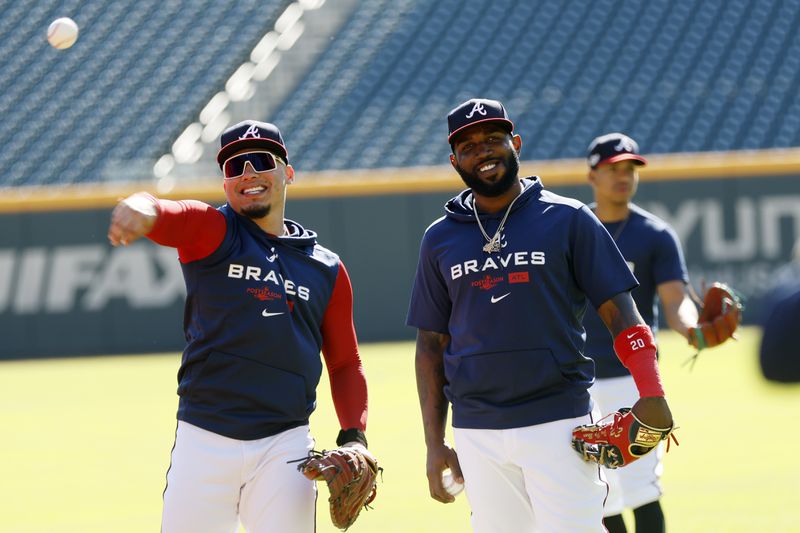 Marcell Ozuna (right) and former Brave William Contreras have fun during a workout prior to the start of the 2022 National League Division Series.
