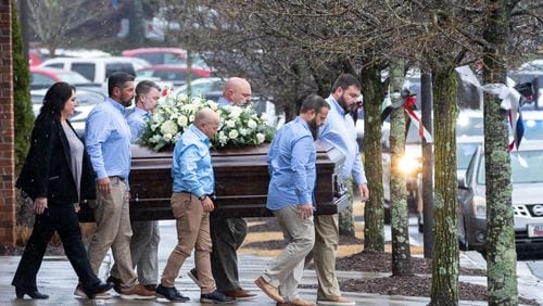 The casket of Laken Riley, the 22-year-old nursing student who was killed last week on the University of Georgia’s campus, is brought to a hearse following her funeral at Woodstock City Church in Woodstock on Friday, March 1, 2024. (Arvin Temkar / arvin.temkar@ajc.com)