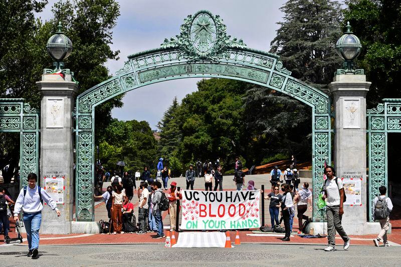 Pro-Palestinians protesters protest in front of Sather Gate during a planned protest on the campus of UC Berkeley in Berkeley, Calif., Monday, April 22, 2024. Hundreds of pro-Palestinian protesters staged a demonstration in front of Sproul Hall where they set up a tent encampment and are demanding a permanent cease-fire in the war between Israel and Gaza. (Jose Carlos Fajardo/Bay Area News Group via AP)