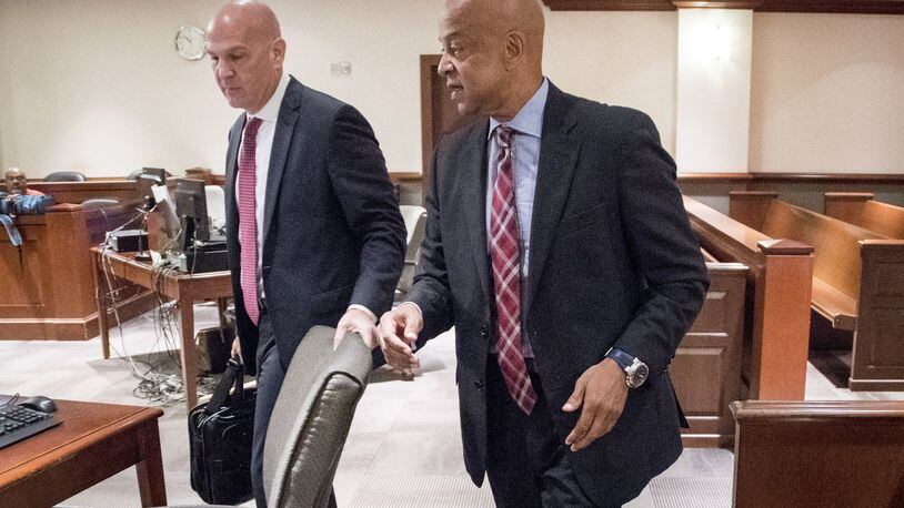 DeKalb Sheriff Jeff Mann, right, and attorney Noah Pines arrive for a hearing to plead not guilty in Atlanta Municipal Court on Friday. Mann was arrested and charged in Piedmont Park on May 6 for exposing himself and running from police. (JOHN AMIS)