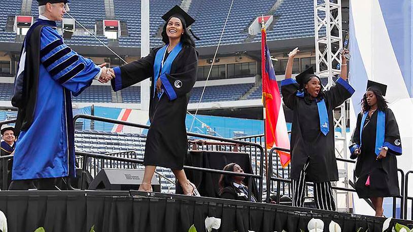 Atlanta - Georgia State University students get their diplomas at the commencement ceremony on May 9, 2019. Georgia State is the largest school in the University System of Georgia, with more than 50,000 students. Bob Andres / bandres@ajc.com