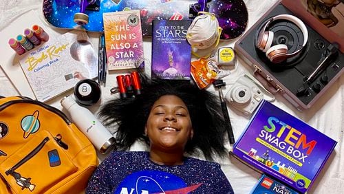 Temple Lester runs an online STEM education and retail site to get her peers, especially girls, to share her excitement for the sciences. The 17-year-old is pictured with her STEM Swag Box, a multi-use science kit for elementary and middle school students. Photo courtesy of Temple Lester