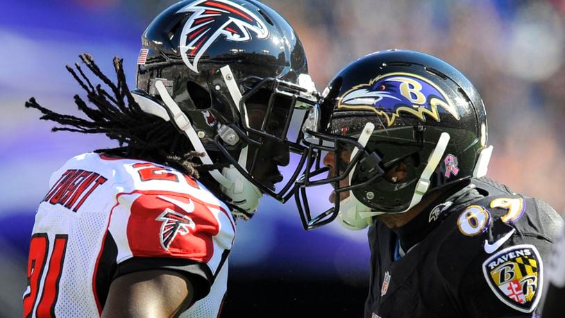 Falcons' Desmond Trufant and Baltimore Ravens' Steve Smith Sr. have a few words for one another after a third quarter play on Sunday, Oct. 19, 2014, at M&T Bank Stadium in Baltimore. (Lloyd Fox/Baltimore Sun/MCT)