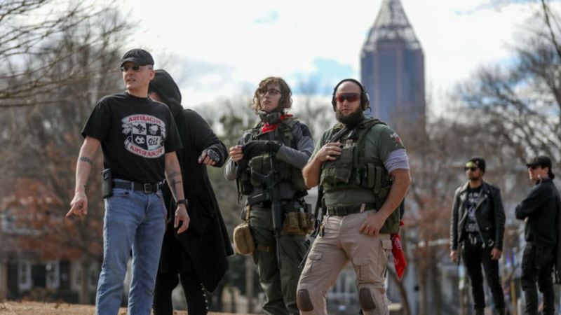 Armed demonstrators - who had earlier attended a rally in Stone Mountain Village to protest against white nationalists - keep watch during a rally in Piedmont Park Saturday, Feb. 2, 2019. The Atlanta event was sponsored by the NAACP, the Southern Christian Leadership Conference, the Southern Poverty Law Center and activist groups Alliance for Black Lives and Georgia Alliance for Social Justice to spotlight racial inequality in the state. (Photo: Branden Camp/The Atlanta Journal-Constitution)