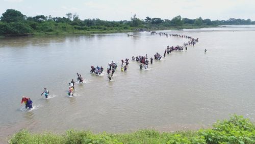 Salvadoran migrants cross the border between Guatemala and Mexico in November, 2018. (AP Photo/Oscar Rivera)