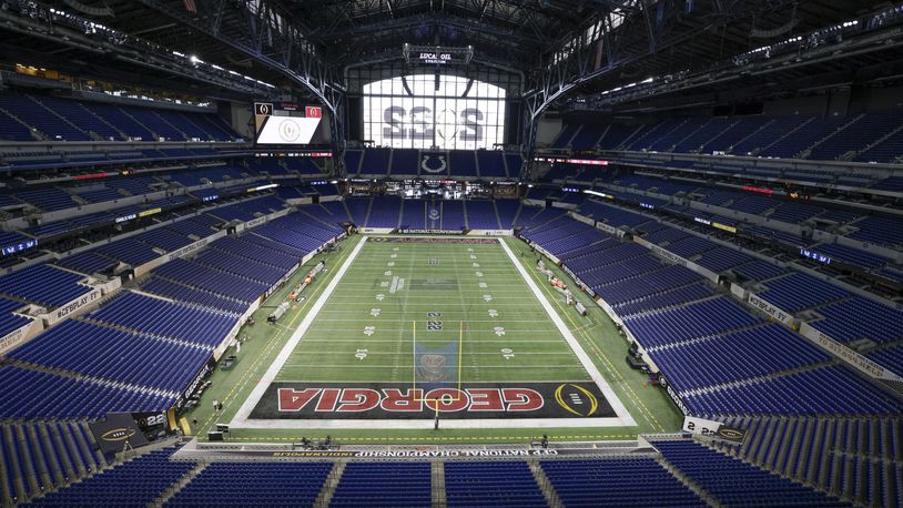 1/9/22 - Indianapolis - Other than the center logo, the field is nearly ready at the 2022 College Football Playoff National Championship  between the Georgia Bulldogs and the Alabama Crimson Tide at Lucas Oil Stadium in Indianapolis on Sunday, January 9, 2022.   Bob Andres / robert.andres@ajc.com