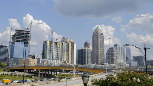 The skyline of midtown Atlanta is visible from Atlantic Station on Thursday, Aug. 12, 2021. (Christine Tannous / christine.tannous@ajc.com)