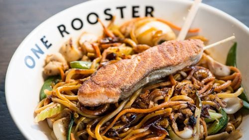 One Rooster Lo Mein bowl with calamari, veggies, ginger teriyaki sauce, and seared salmon. Photo credit - Mia Yakel.