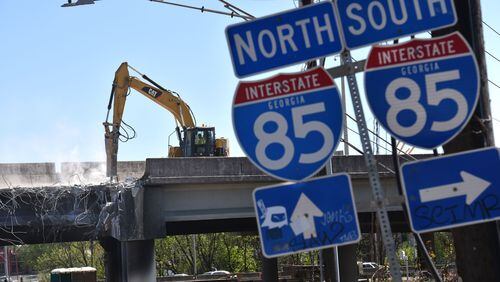 Crews demolish damaged sections of I-85 bridge structures on Saturday, April 1, 2017. With I-85 closed for an indefinite amount of time, Atlanta is headed for a transportation nightmare. HYOSUB SHIN / HSHIN@AJC.COM